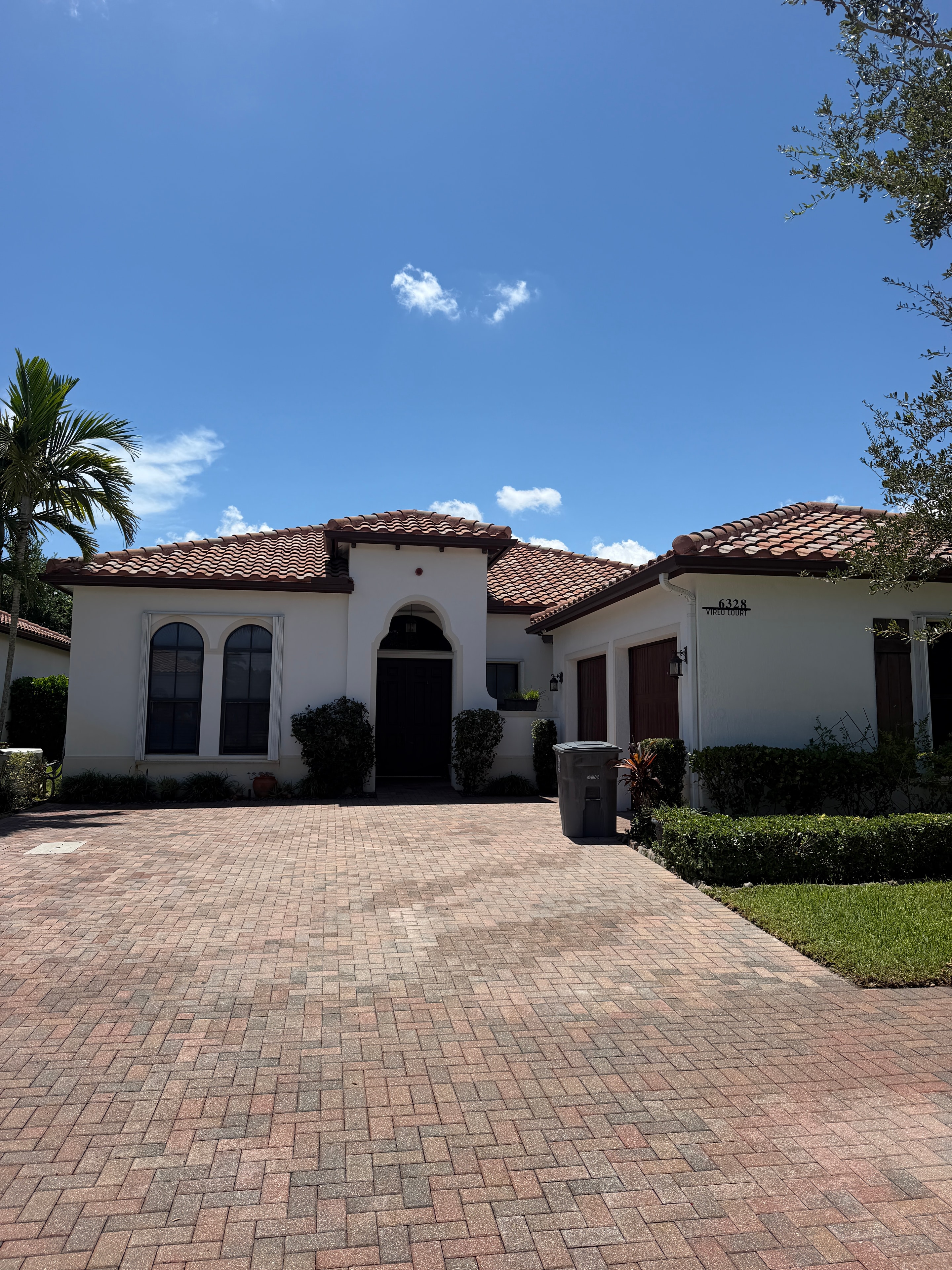 Paver Driveway After Clean — White Stucco Home