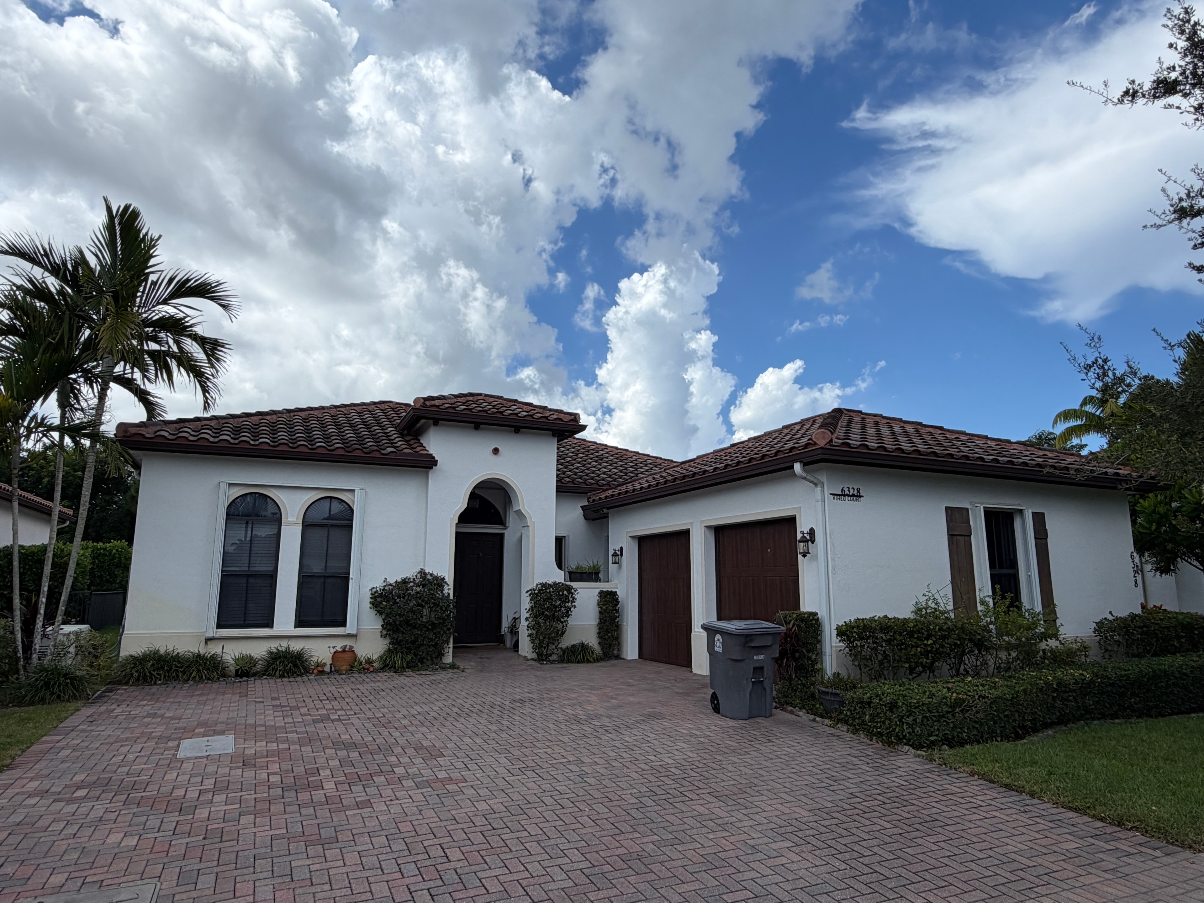 House Wash Complete — Tile Roof & Paver Driveway